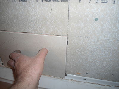 sticking ceramic tile to wall
